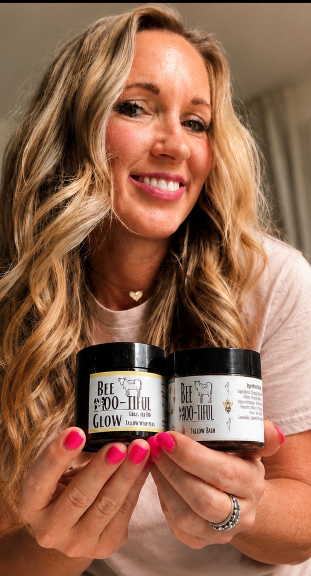 BeeMootiful tallow whip cream held by founder